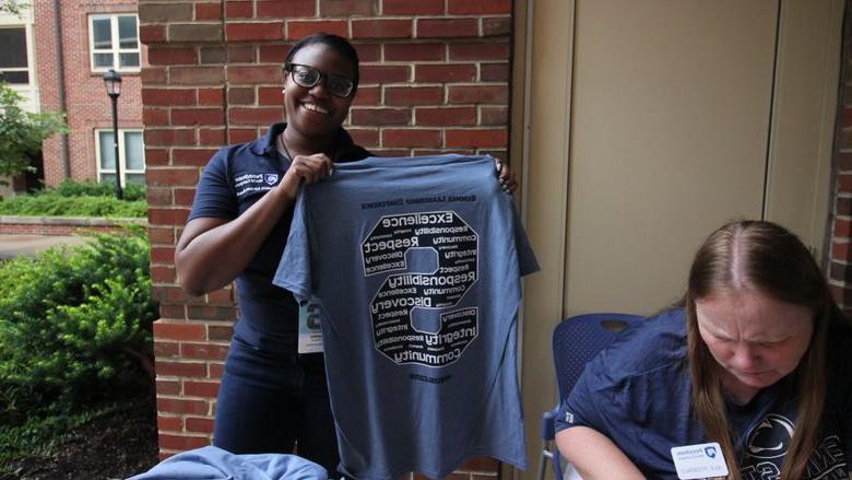 Penn State staff checks-in delegates to the Summer Leadership Conference