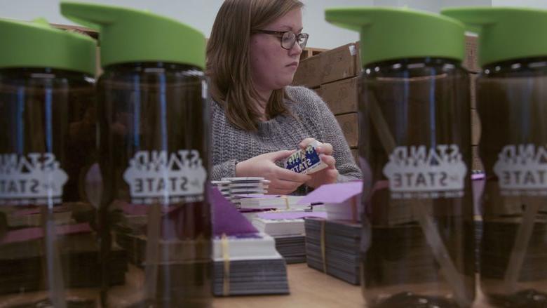 A student organizes stickers 