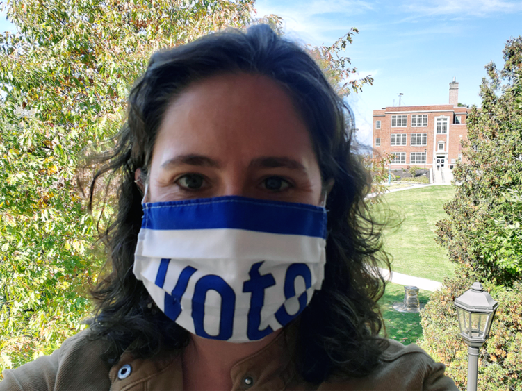 Female professor wearing mask with "Vote" 