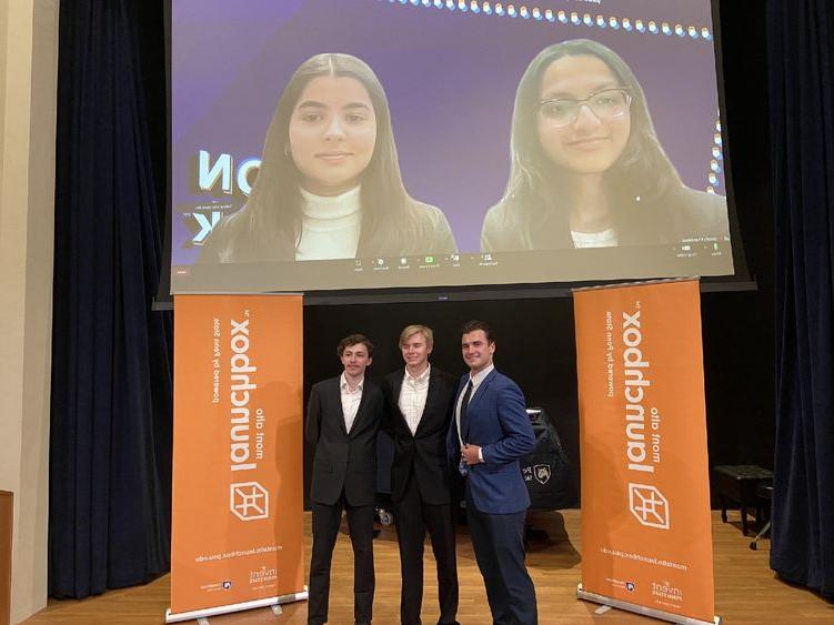 Winners of the 2023 LION Tank Pitch Competition stand and smile in front of Mont Alto Launchbox banners.